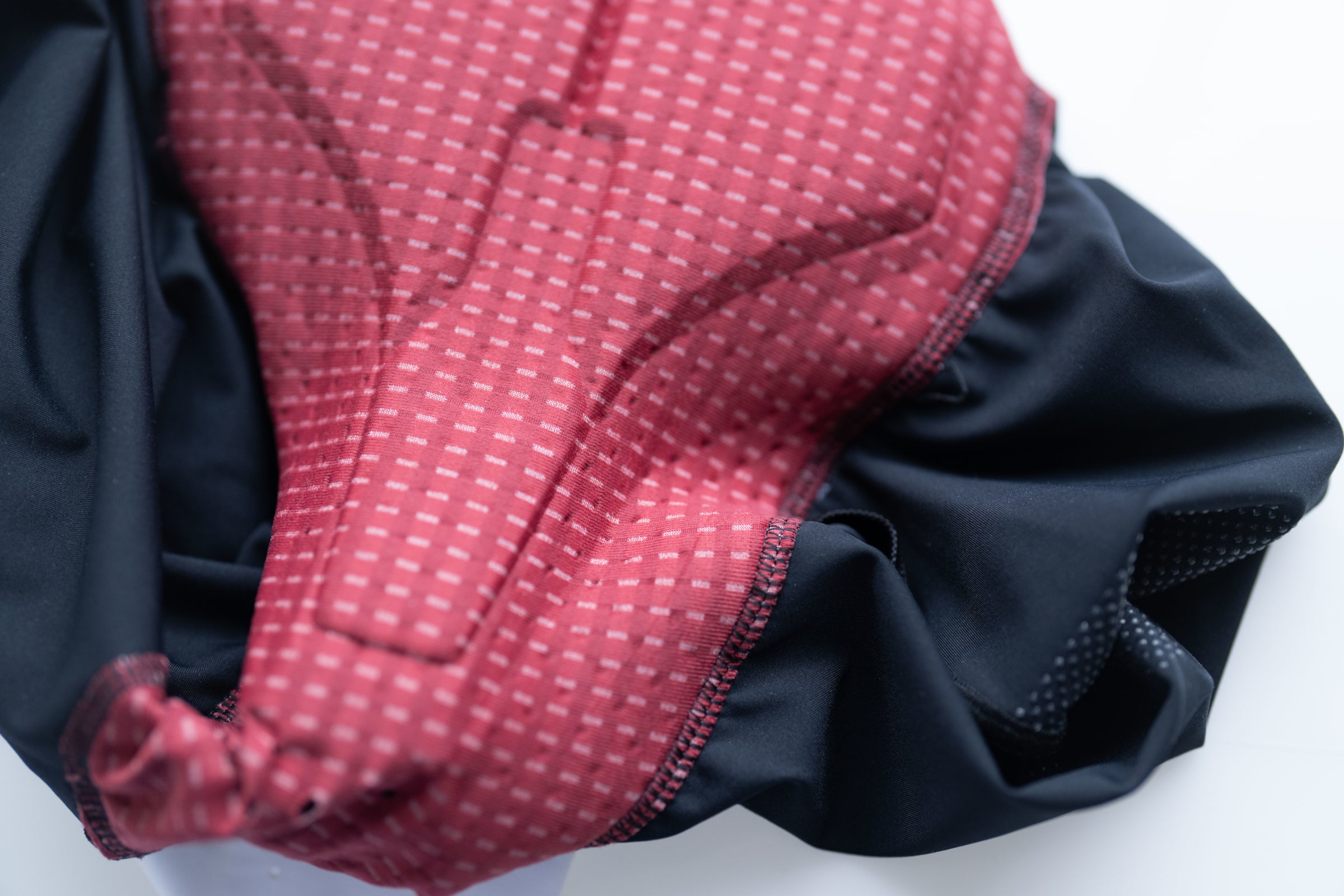 Close-up of padded cycling shorts with textured red chamois