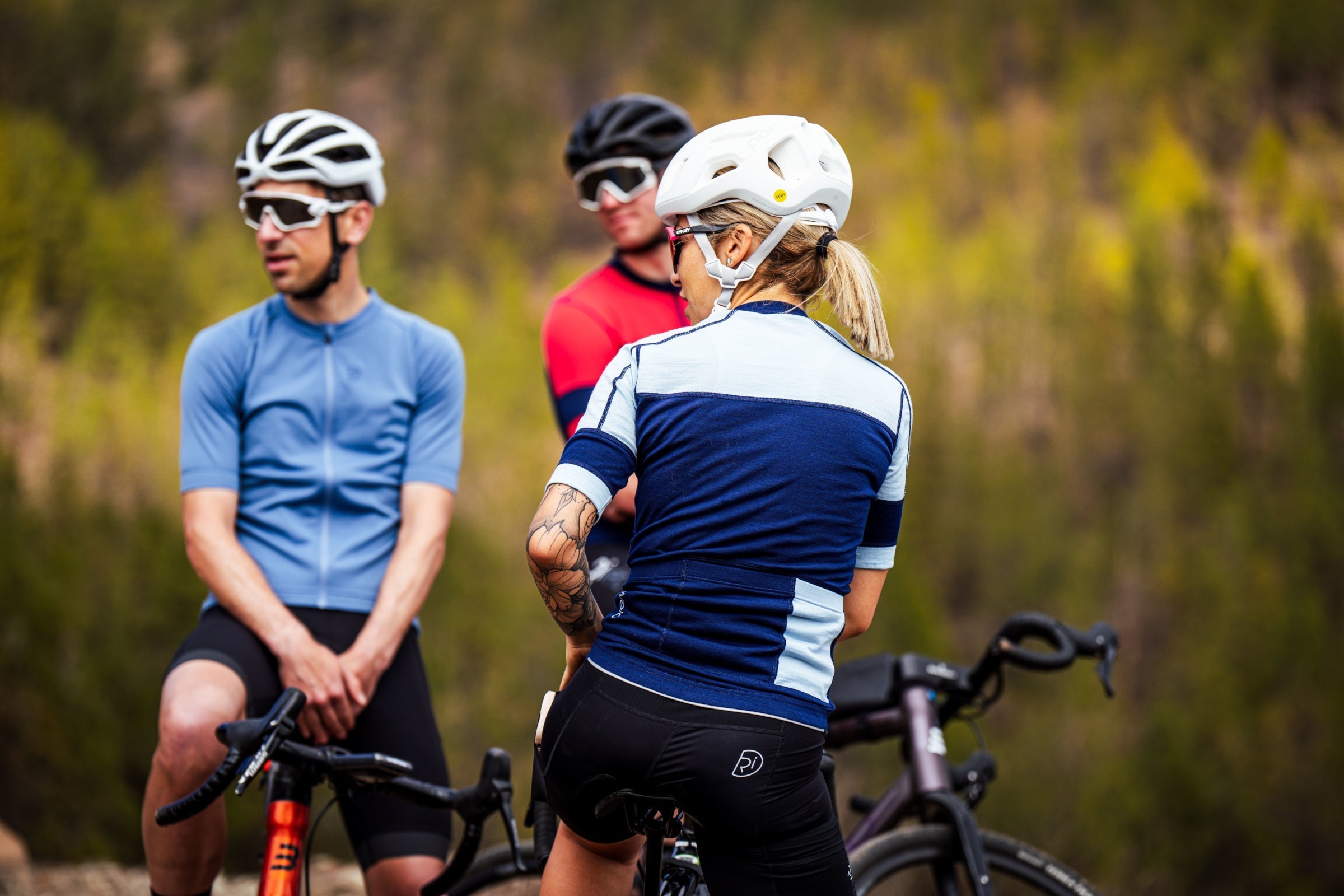 Cyclists in Rivelo kit pausing on a ride outdoors