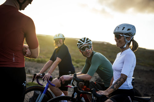 Group of cyclists enjoying a ride at sunset
