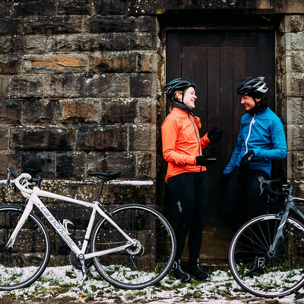 Rivelo Womens Garrowby Packable Jacket (Orange) (model: jen) (align-x: 100%)